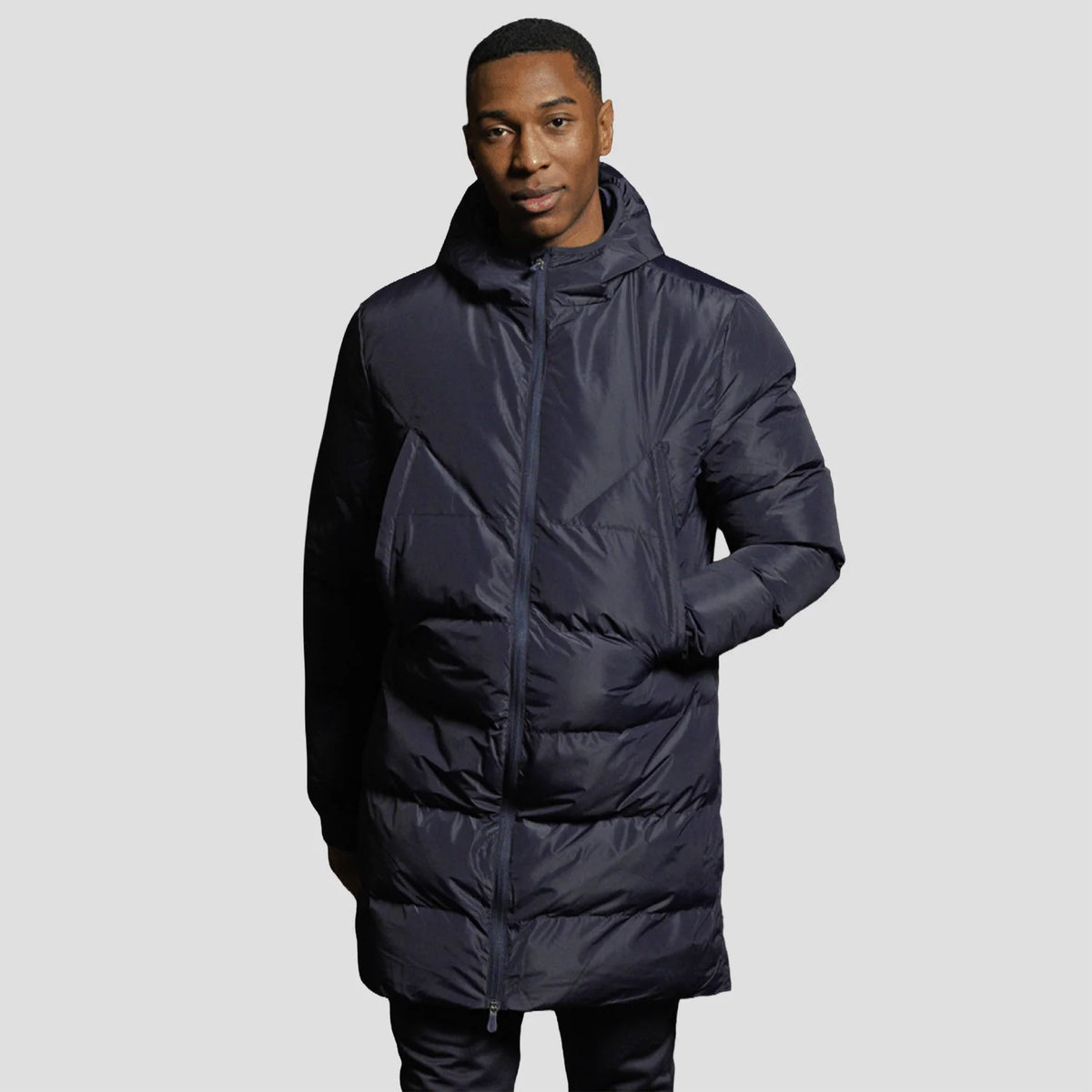 Model wearing the Stuart Surridge Active Long Padded Coat WL005 in Navy.