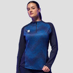 Model wearing the Women's Volt 1/4 Zip Performance Top in Navy.