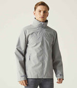 model wearing Regatta RG374 (TRW532) Ascender Waterproof Shell Jacket in mineral grey/black