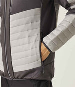 Close-up pocket shot of model wearing the Regatta E-Volve Unisex Thermal Hybrid Jacket in Mineral Grey/Black