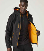 Model wearing the Regatta Navigate Two Layer Hooded Soft Shell Jacket RG454 in Black / Orange Pop