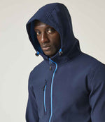 Model wearing the Regatta Navigate Two Layer Hooded Soft Shell Jacket RG454 in Navy / French Blue, hood up