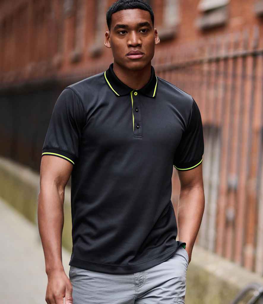 Model wearing the Regatta Navigate Polo Shirt in Black / Lime Green