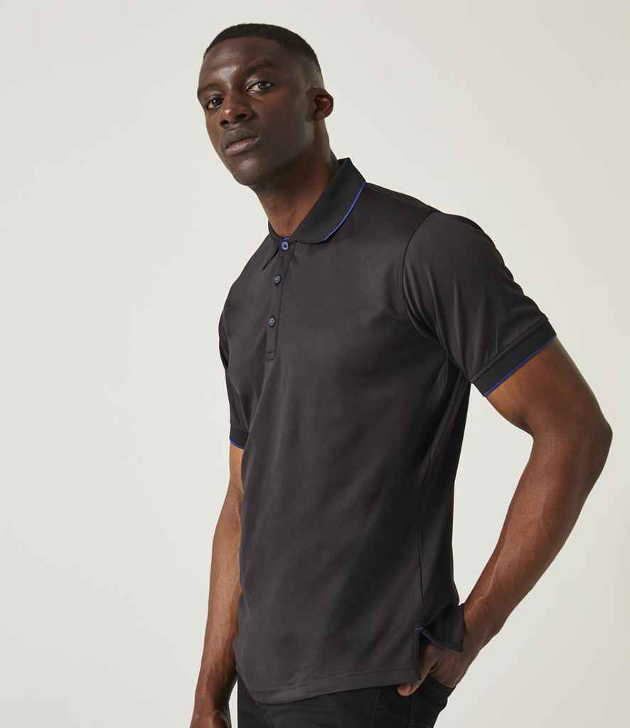 Model wearing Regatta Navigate Polo Shirt in Black / Royal